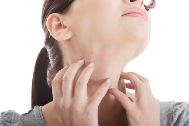 Young woman is scratching her neck. clipart