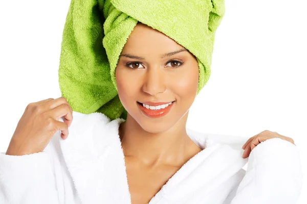 Portrait of attractive smiling woman wrapped in towel with turba — Stock Photo, Image