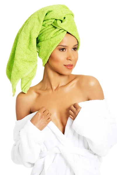 Attractive woman wrapped in towel with turabn. — Stock Photo, Image