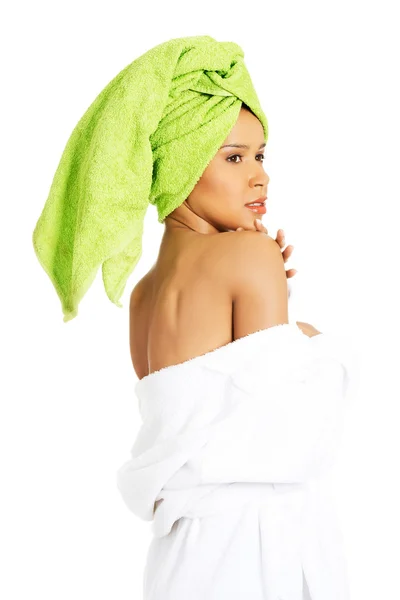 Attractive woman wrapped in towel with turban. — Stock Photo, Image