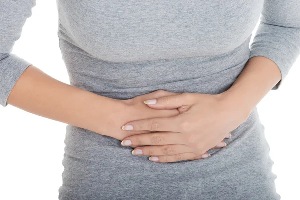 Jonge casual meisje vrouw heeft buikpijn. — Stockfoto