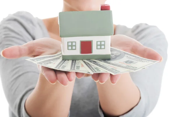 Young casual woman with money and house. — Stock Photo, Image