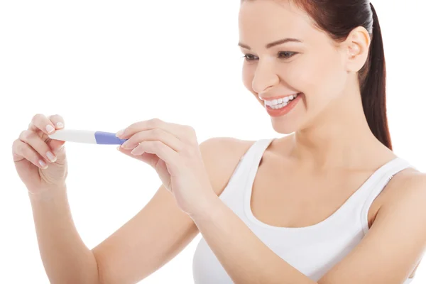 Happy smiling woman with pregnancy test. — Stock Photo, Image