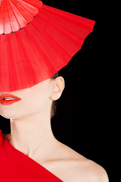 Beautiful sexy woman in red dress and fan. — Stock Photo, Image