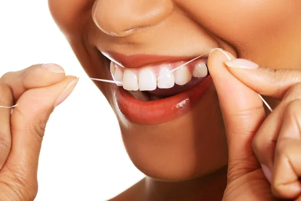 Attractive woman with dental floss. Closeup. Stock Image