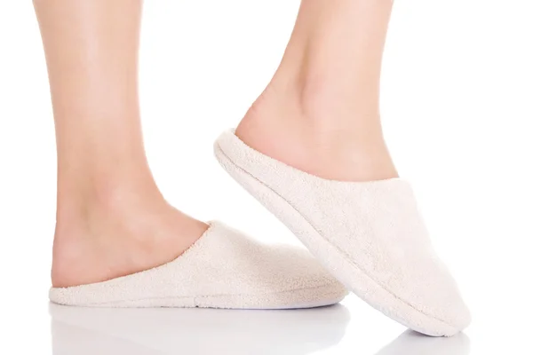 Female's feet with white slippers. — Stock Photo, Image