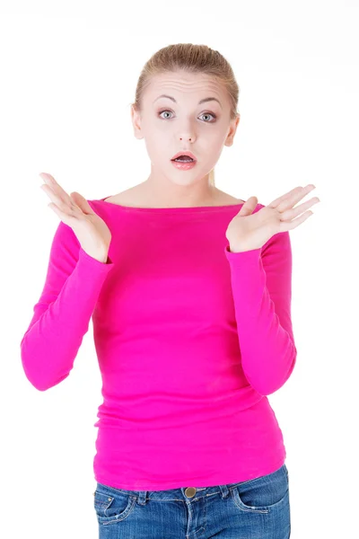 Young casual woman student expresses shock, surprise. — Stock Photo, Image