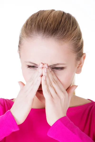 Young caucassian woman is having sinus pressure. — Stock Photo, Image