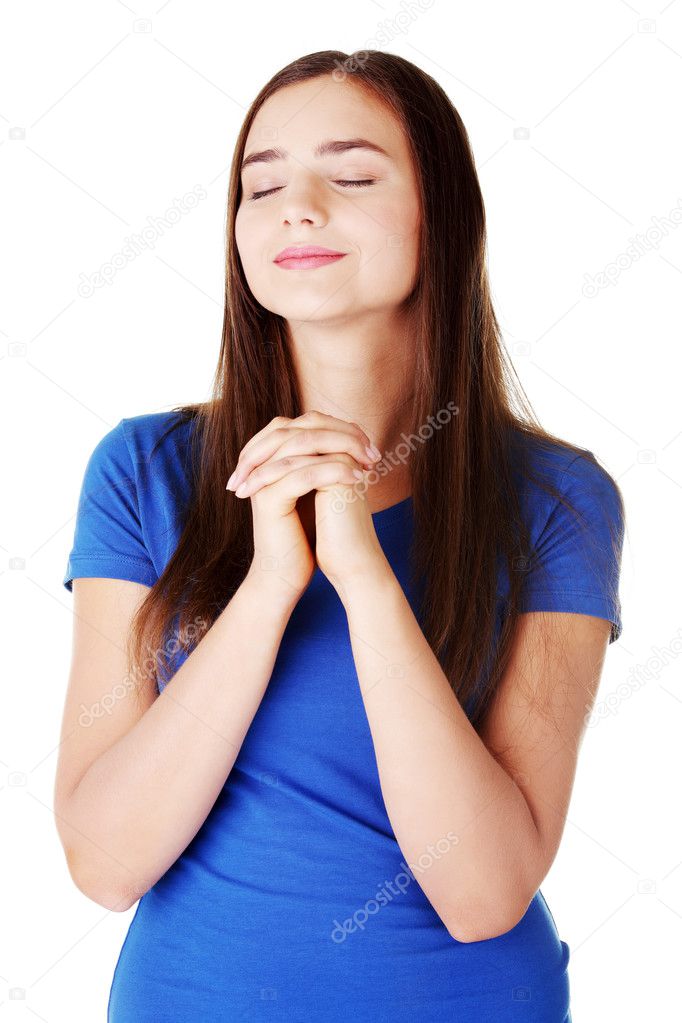 Young beautiful woman is praying.