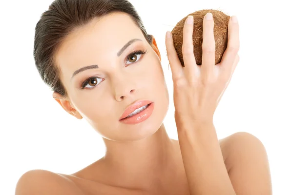 Beautiful woman with coconut in hands — Stock Photo, Image