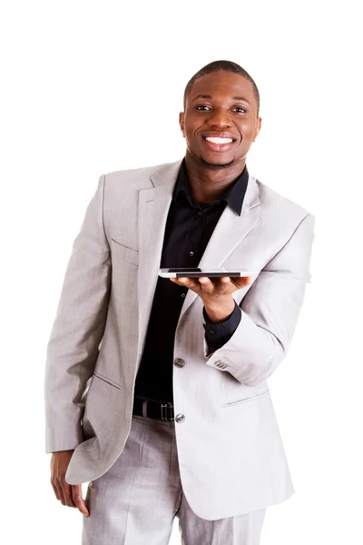 Przystojny biznesmen działa na komputerze typu tablet. — Zdjęcie stockowe