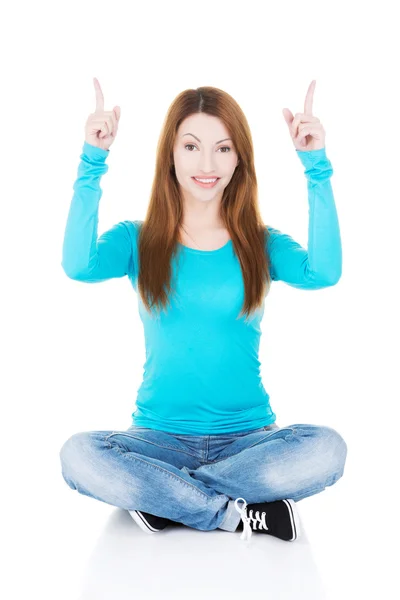Happy , excited young woman pointing on copy space — Stock Photo, Image