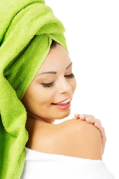 Beautiful woman with a towel on her head — Stock Photo, Image