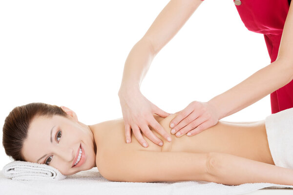 Preaty woman relaxing beeing massaged in spa