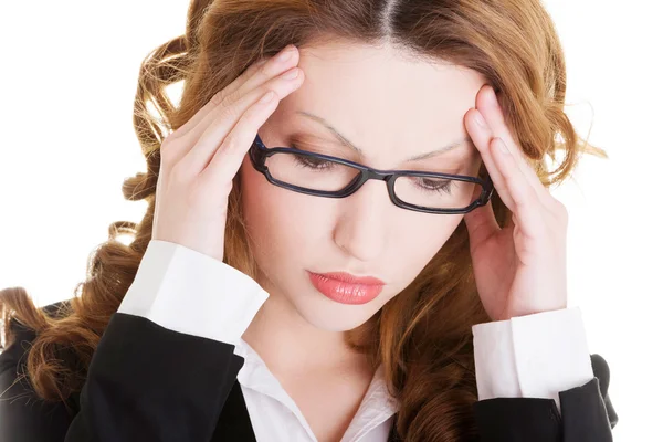 Businesswoman with a headache holding head — Stock Photo, Image