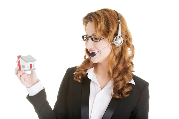 Call center assistente donna con modello di casa — Foto Stock