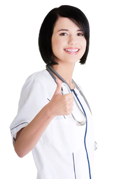 Junge Ärztin oder Krankenschwester gestikuliert ok — Stockfoto