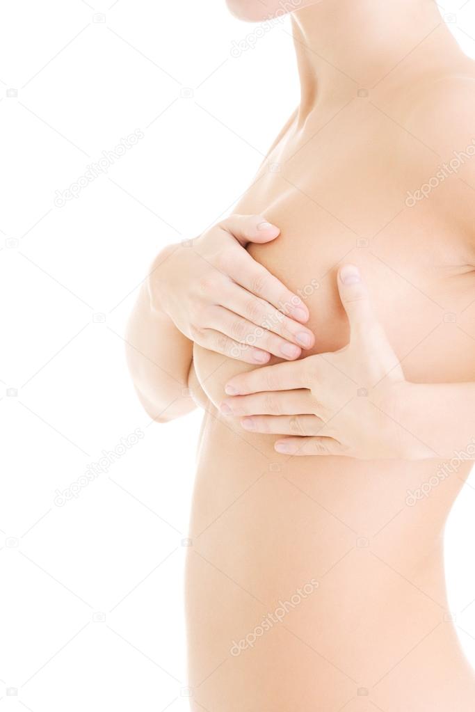 Caucasian adult woman examining her breast