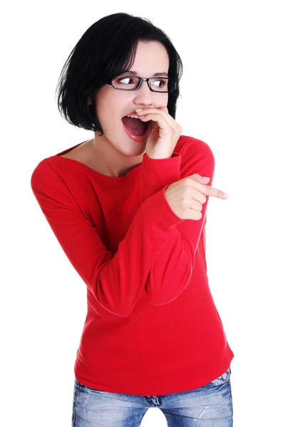 Excited young woman pointing on copy space — Stock Photo, Image