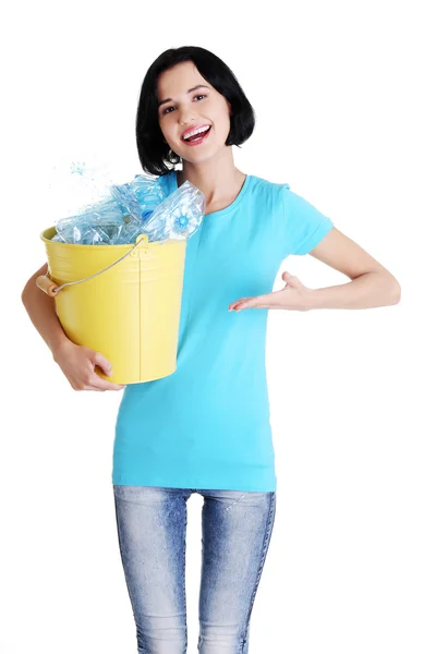 Beautiful young woman holding recycling bin — Stock Photo, Image