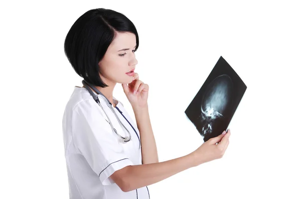 Female doctor or nurse looking at radiography photo — Stock Photo, Image