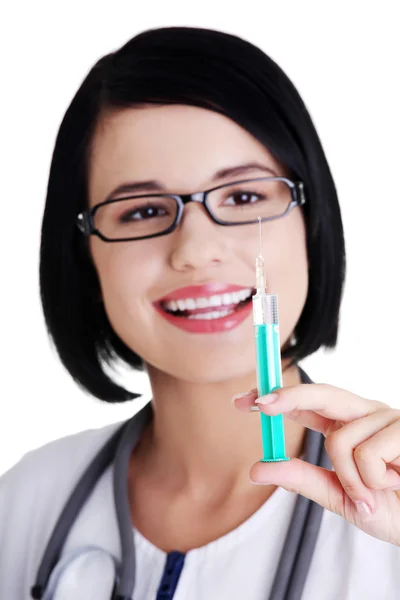 Happy medical doctor or nurse with syringe — Stock Photo, Image