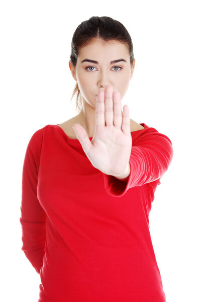 Hold on, Stop gesture showed by young woman