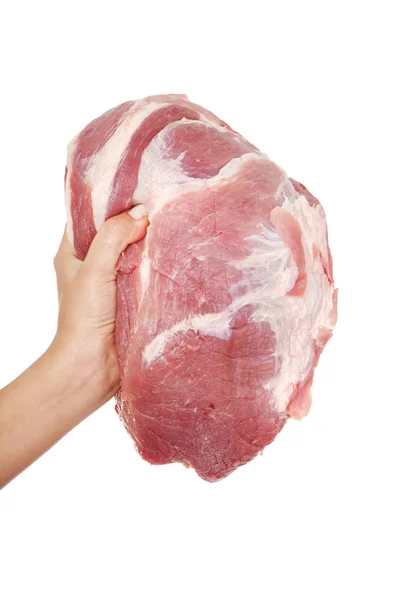 Kvinnlig hand som håller rått fläskkött. — Stockfoto