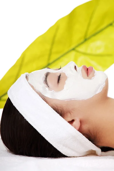 Beautiful woman with clay facial mask Stock Picture
