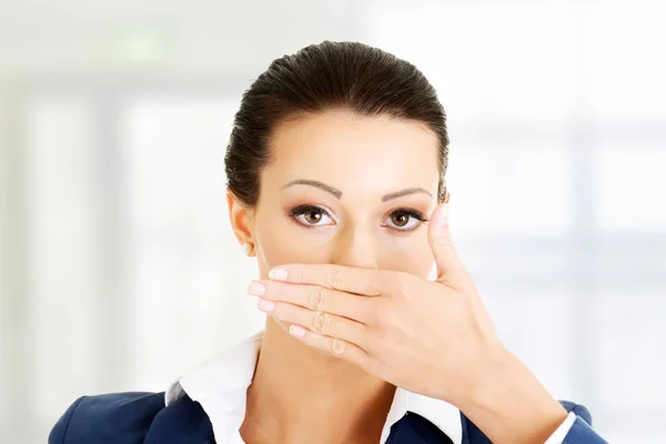 Young business woman covering her mouth — Stock Photo, Image