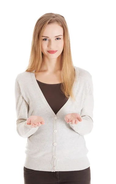 Beautiful casual woman is having a copy space on her palms — Stock Photo, Image