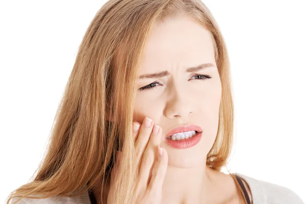 Mooie casual vrouw met kiespijn. — Stockfoto