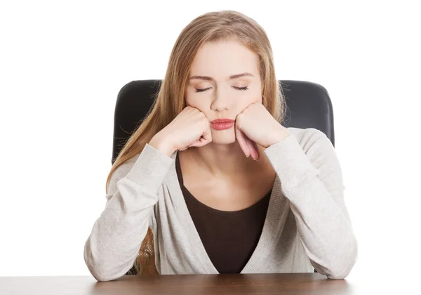 Beautiful casual, bored or sleeping student woman by a desk. — Stock Photo, Image