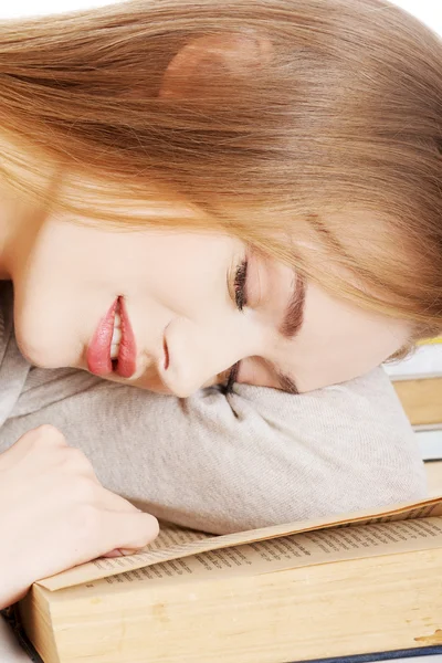 Beautiful woman is sleeping on a book. — Stock Photo, Image