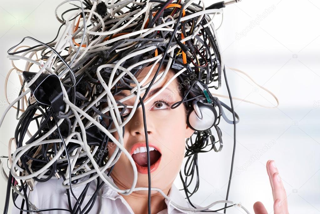 Troubled businesswoman with cables on head