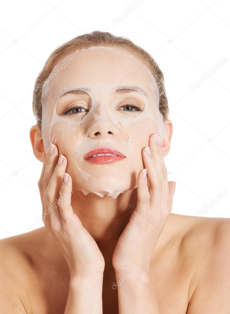 Beautiful woman with collagen mask on face.