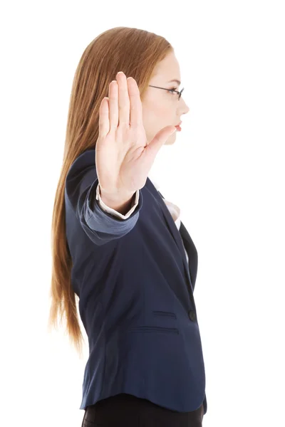 Biznes kobieta pokazano przystanek gest rękąόμορφης επιχειρηματικής γυναίκα που δείχνει στάση χειρονομία με το χέρι. — Zdjęcie stockowe