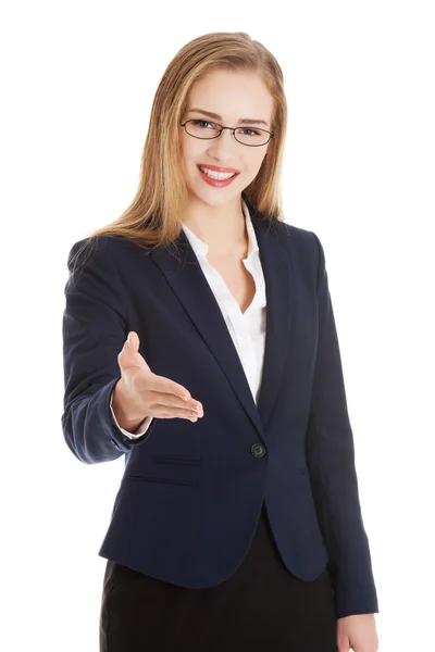 Beautiful caucasian business woman giving a hand. — Stock Photo, Image