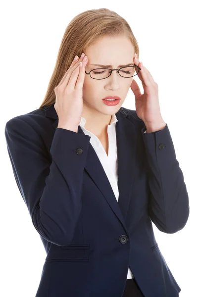 Beautiful business woman is having a headache. — Stock Photo, Image