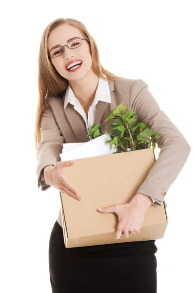 Beautiful business woman holding box with office items. — Stock Photo, Image