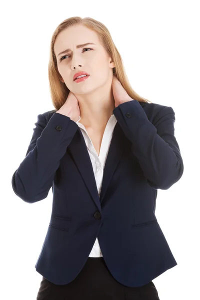 Hermosa mujer de negocios caucásica tocando su cuello . —  Fotos de Stock