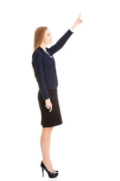 Beautiful business woman pointing on copy space. — Stock Photo, Image