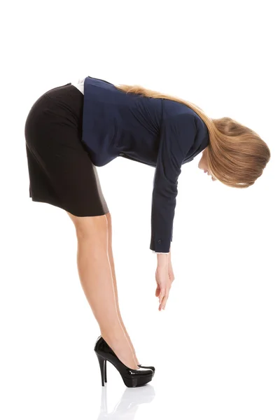 Beautiful caucasian business woman bending down. — Stock Photo, Image