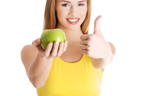 Beautiful casual caucasian woman holding fresh green apple. — Stock Photo, Image