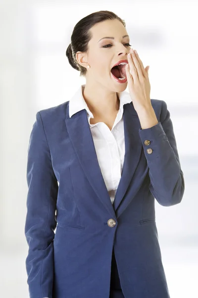 Tired business woman in a suit ,isolated over white background — Stock Photo, Image