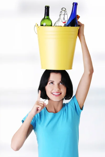 Beautiful young woman holding recycling bin — Stock Photo, Image
