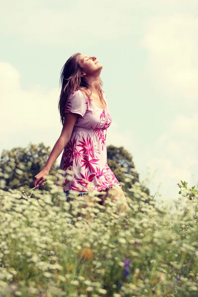 Smile teen open hands standing on field — Stock Photo, Image