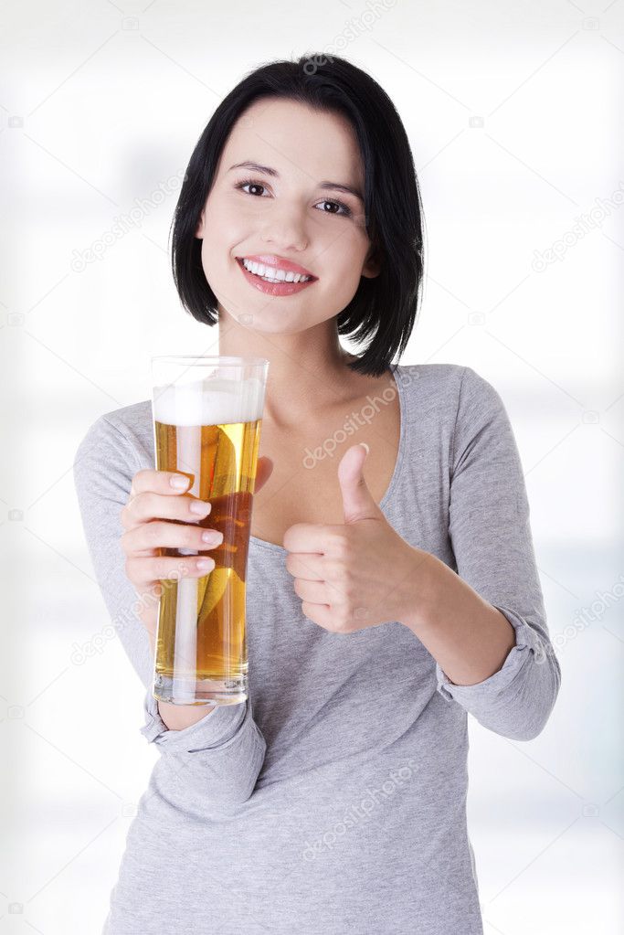 Beautiful and sexy young woman with beer