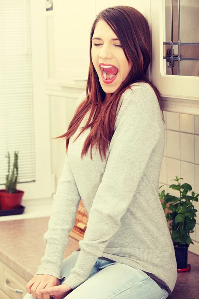 Young tired woman in kitchen — Stock Photo, Image