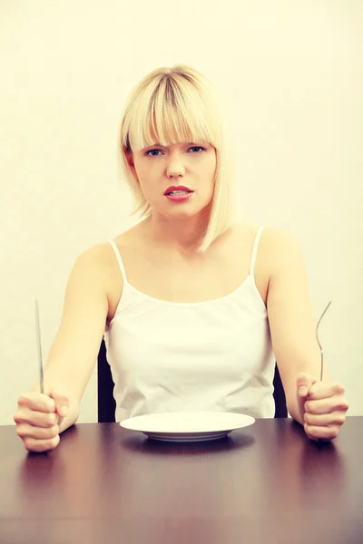 Hungry woman. Stock Picture